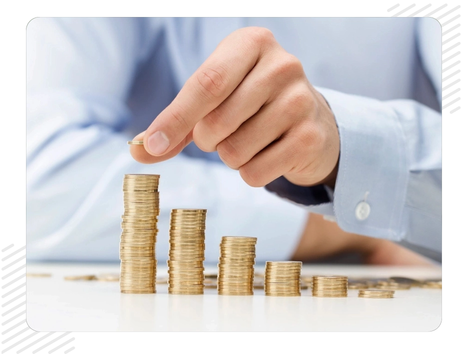 A person is putting money in piles of coins.